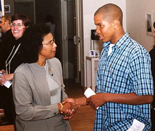 Dr. Hadley congratulates James Stephenson on his essa