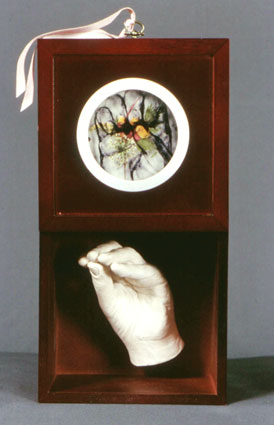 Artists' Hand: Grasp (open), FOR KEEP'S SAKE series, 2001, resin, wood, drawing/print on mylar, pressed flowers, 7 x 7 x 5 inches