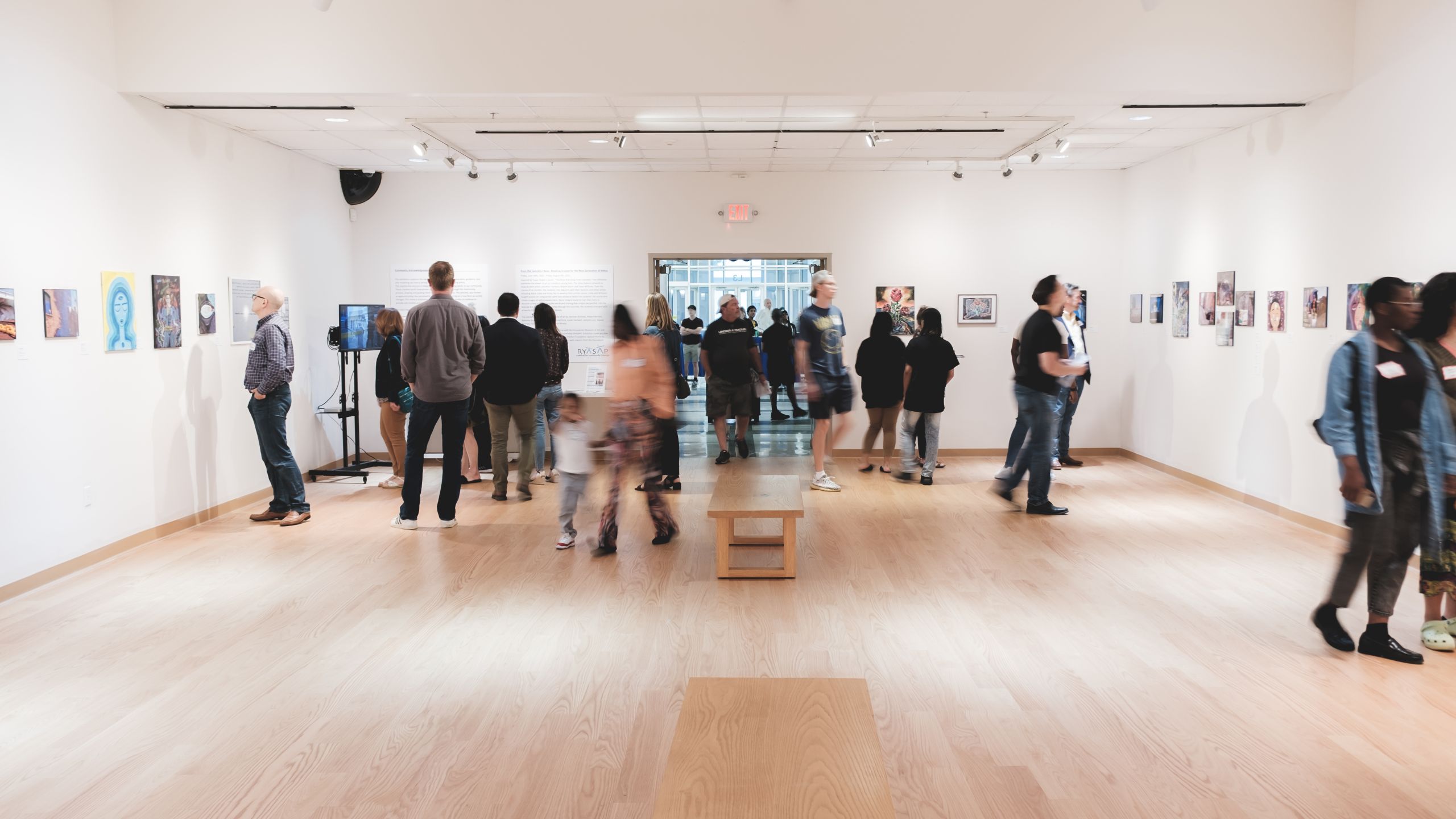 People enjoying exhibition in the Burt Chernow Galleries