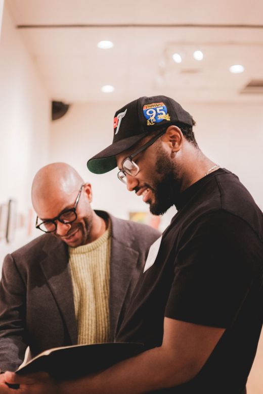 Two students looking at artwork