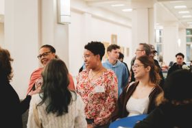 Two students looking at artwork